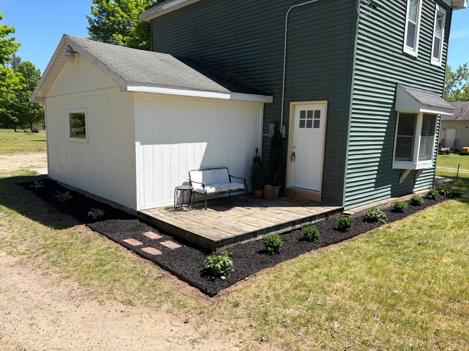 Fresh mulch bed and landscaping around a home